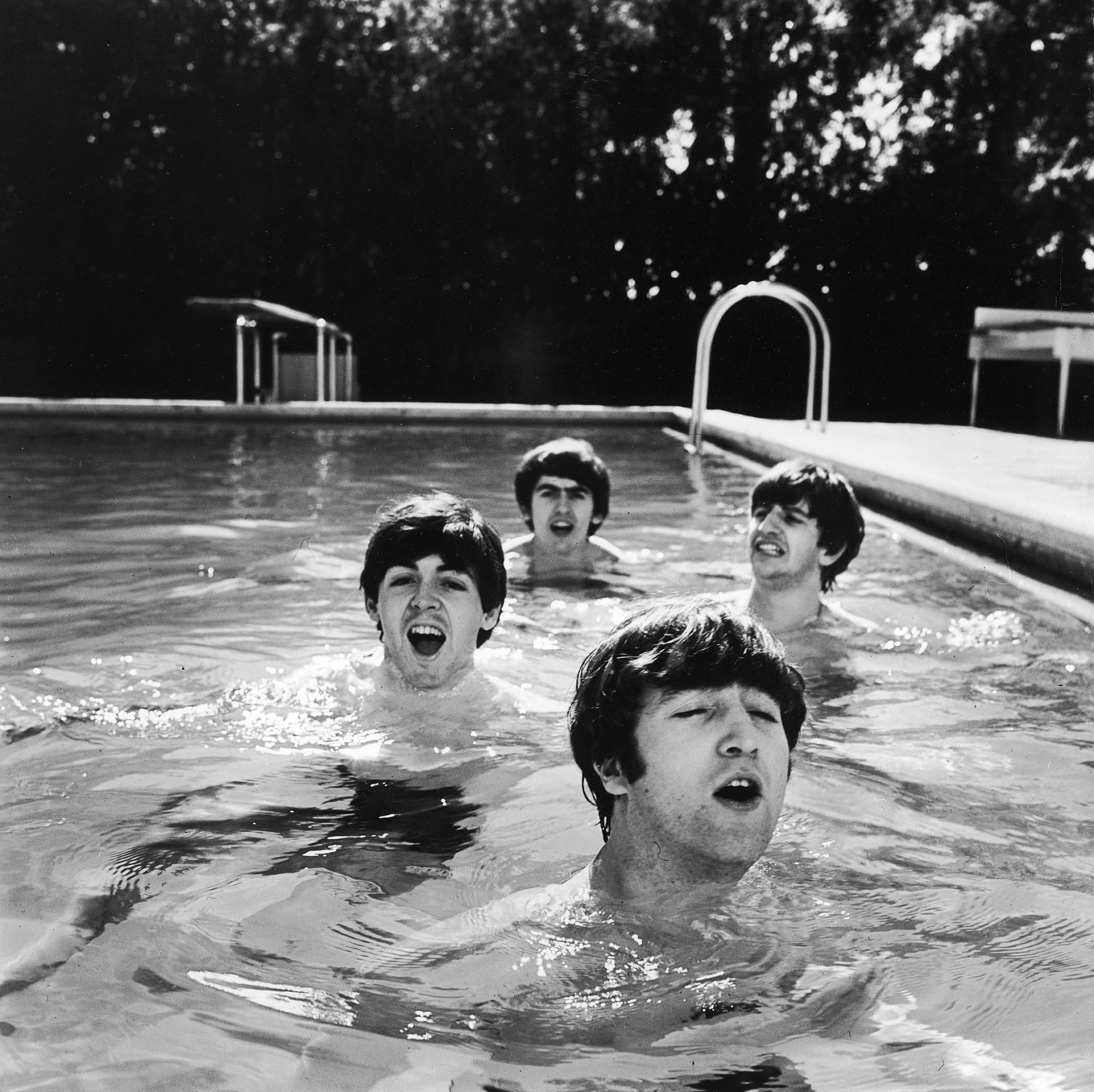FLORIDA, UNITED STATES – FEBRUARY 1964: (L-R) Paul McCartney, George Harrison, John Lennon & Ringo Starr of the Beatles, taking a dip in a swimming pool . (Photo by John Loengard/Life Magazine/Time & Life Pictures/Getty Images)